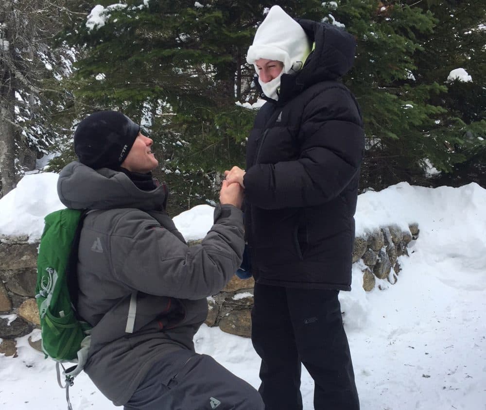 Josh Darnell, of Londonderry, New Hampshire, proposes to Rachel Raske, of Lowell, Massachusetts, on Dec. 28 in Tuckermans Ravine, New Hampshire, on the same day the temperature dropped to minus-34 on nearby Mount Washington. Raske said yes. (Doug Darnell via AP)