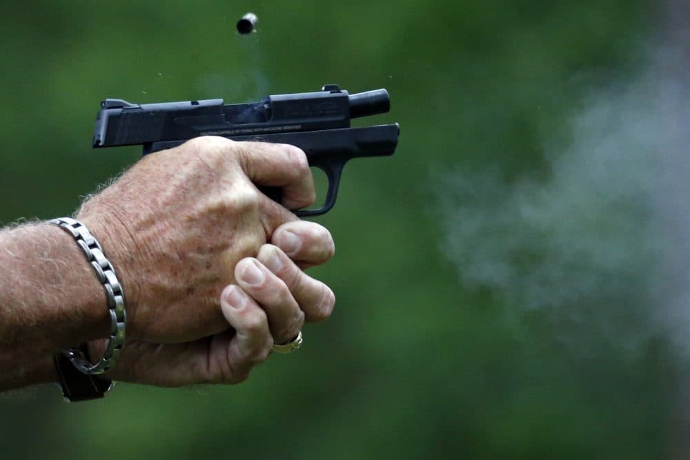 In this April 30, 2016 photograph, gun smoke and a spent round is ejected from a participant's automatic handgun during the live fire portion of a enhanced concealed carry class sponsored by Crestview Baptist Church for members and area residents in Petal, Miss. The 20 participants received hands on assistance during a practical shooting exercise, a thorough review on the fundamentals of safe handling of firearms in addition to a review of the basic and enhanced Mississippi Concealed Carry laws. (AP Photo/Rogelio V. Solis)