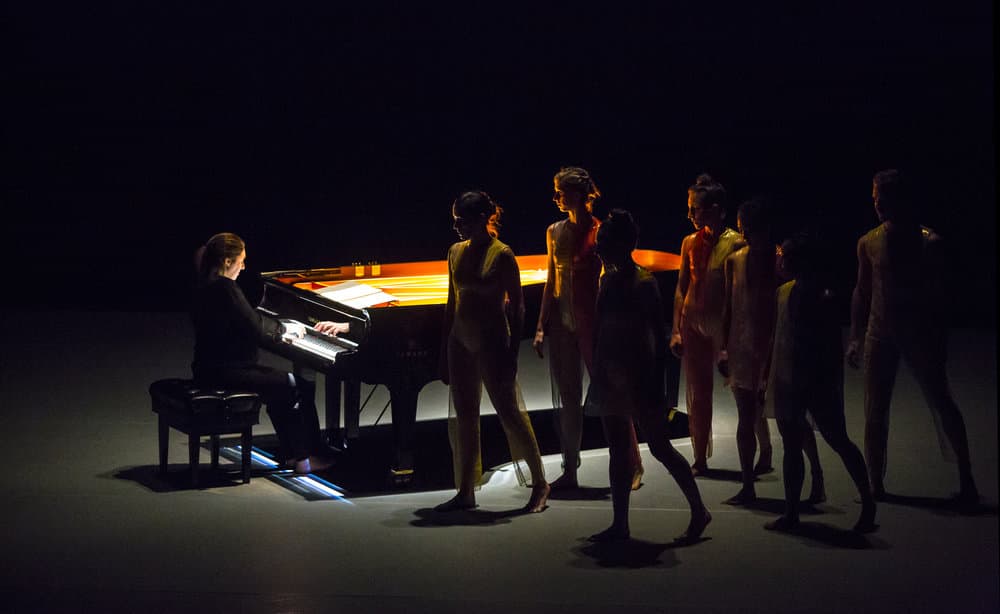 Simone Dinnerstein on piano with dancers Melissa Toogood, Lindsey Jones, Maggie Cloud, Netta Yerushalmy, Maile Okamura, Christine Flores and Jason Collins. (Courtesy Marina Levitskaya)