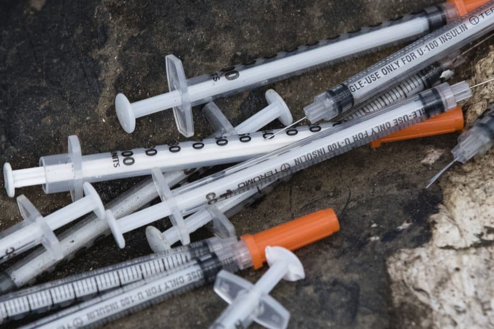 Discarded syringes lay near near train tracks in Philadelphia, Monday, July 31, 2017. Workers are preparing to clean up the open-air heroin market that has thrived for decades along a set of train tracks a few miles outside the heart of Philadelphia. (AP Photo/Matt Rourke)