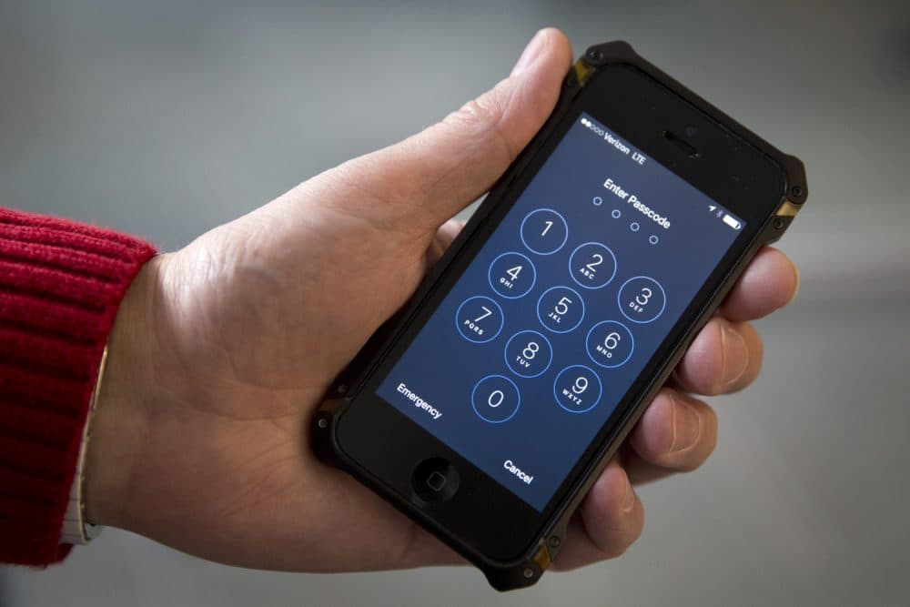 In this Feb. 17, 2016, file photo an iPhone is seen in Washington. A new lawsuit claims the governments practice of searching laptops and cellphones at airports and border crossings is unconstitutional because modern electronic devices carry troves of private information.  (AP Photo/Carolyn Kaster, File)