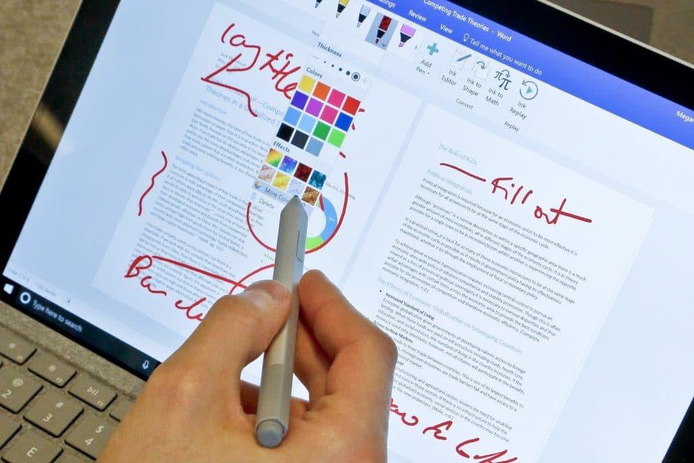 In this Tuesday, May 16, 2017, photo, Microsoft's new Surface Pro laptop-tablet hybrid is displayed, in New York. The Surfaces stylus will now mimic pencil shading when tilted, much like the Apple Pencil for iPad Pro tablets. Along with this, Microsoft plans upgrades to its popular Office software with new pencil-like features. (AP Photo/Bebeto Matthews)