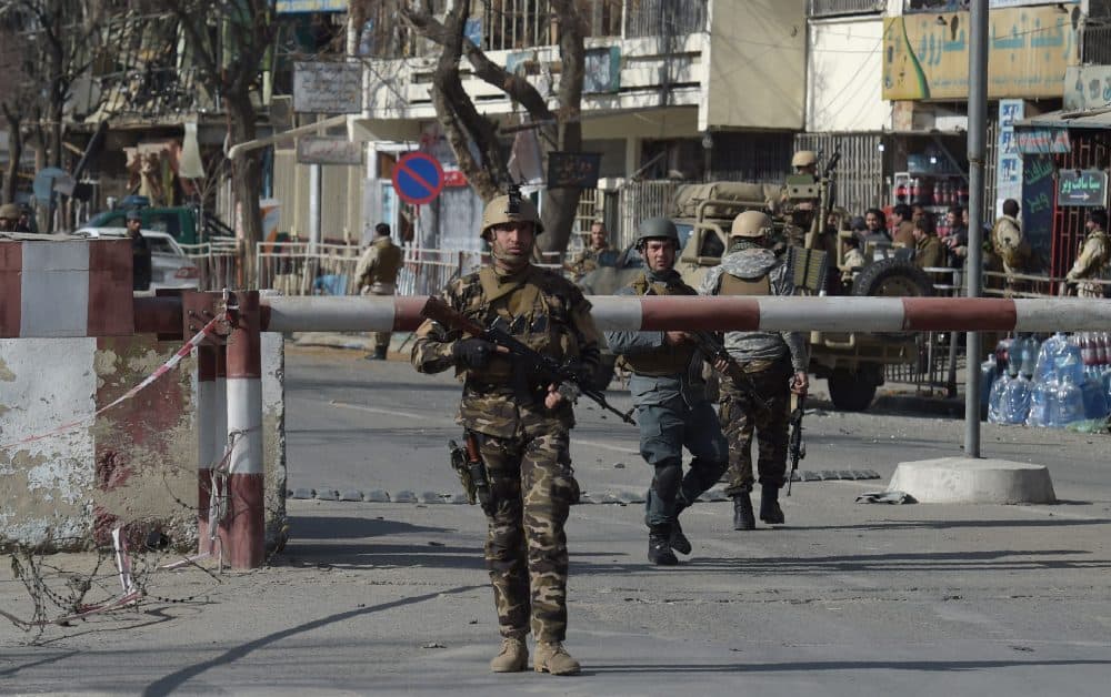 Afghan security personnel arrive at a site after a car bomb exploded near the old Ministry of Interior building in Kabul on Jan. 27, 2018. (Wakil Koshar/AFP/Getty Images)