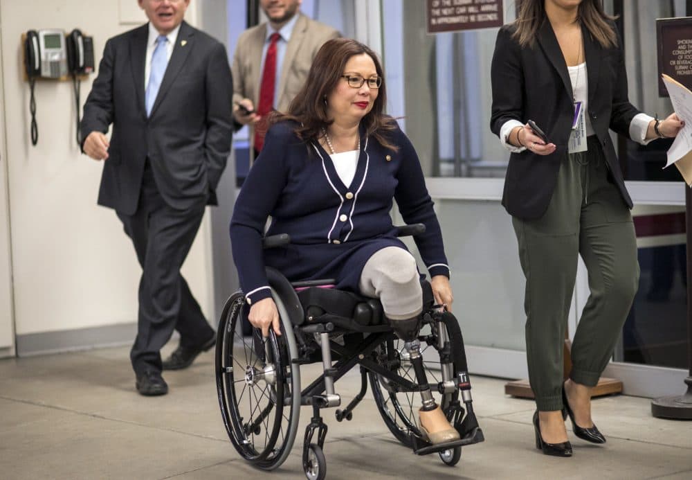 Sen. Tammy Duckworth (D-Ill.) and other senators arrive for a vote at the U.S. Capitol in Washington, D.C. Wednesday, Jan. 24, 2018. (J. Scott Applewhite/AP)