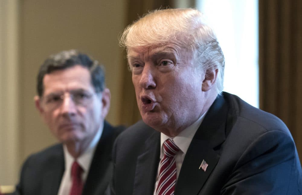 President Donald Trump, joined by Sen. John Barrasso, R-Wyo., left, speaks to media during a meeting with bipartisan members of Congress about infrastructure in the Cabinet Room of the White House in Washington, Wednesday, Feb. 14, 2018. (Carolyn Kaster/AP)