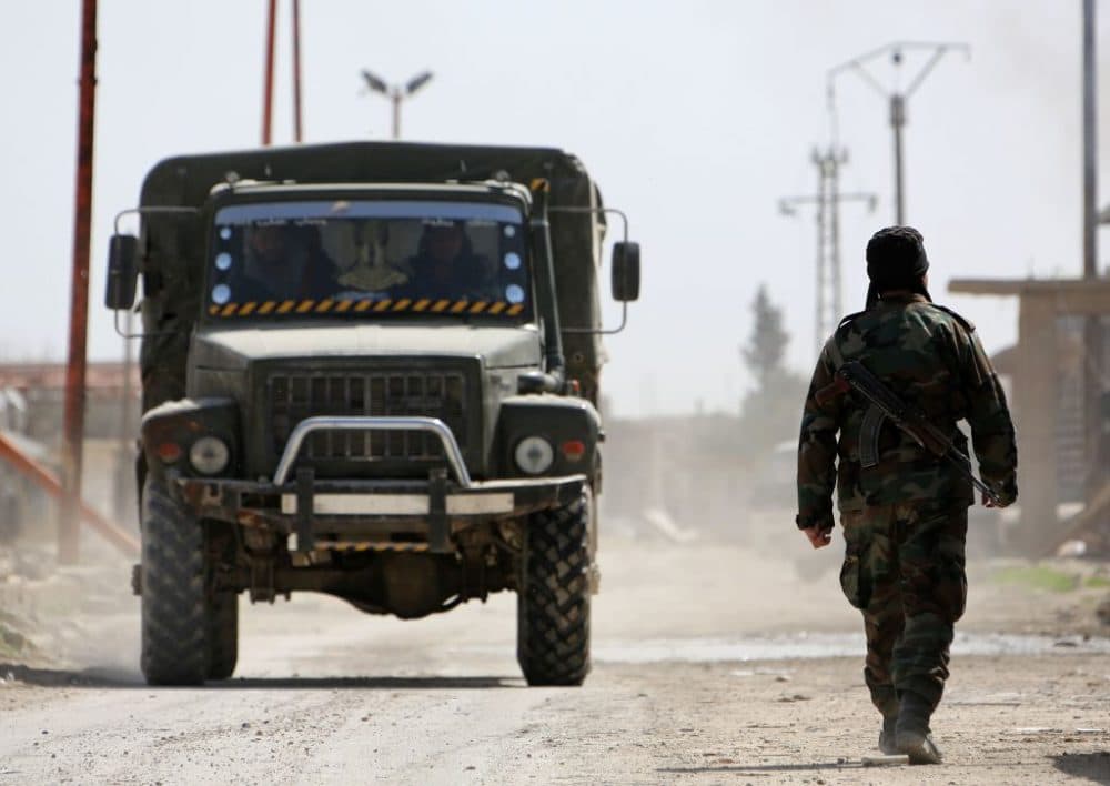 Syrian regime forces enter the village of Utaya on March 5, 2018, as they seized more ground in a fierce offensive to retake the battered rebel enclave of Eastern Ghouta. Regime troops and allied forces pushed into the enclave from the east in recent days and have retaken a third of Eastern Ghouta, according to the Syrian Observatory for Human Rights.
(Stringer/AFP/Getty Images)