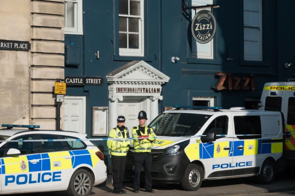 Police officers stand outside a branch of the Italian chain restaurant Zizzi close to The Maltings shopping center in Salisbury which has been closed in connection with an ongoing major incident sparked after a man and a woman were found critically ill on a bench outside the shopping center on Sunday,March 7, 2018 in Wiltshire, England. Sergei Skripal, who was granted refuge in the U.K. following a "spy swap" between the U.S. and Russia in 2010, and his daughter, remain critically ill after being exposed to an "unknown substance." (Matt Cardy/Getty Images)