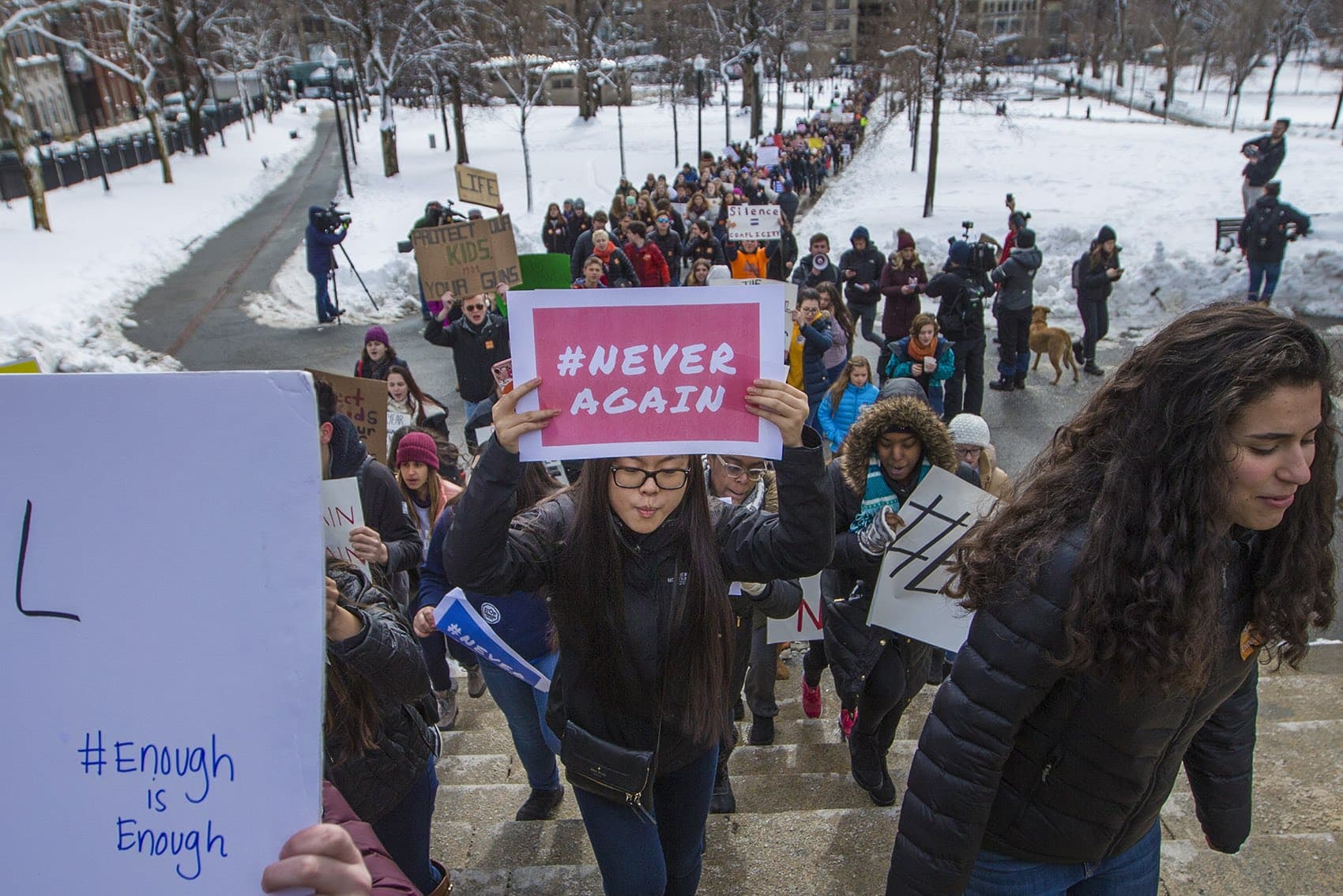 Student calling for stricter gun laws march across Boston Common from St. Paul's Catherdral to the State House one month after the Parkland shooting. (Jesse Costa/WBUR)