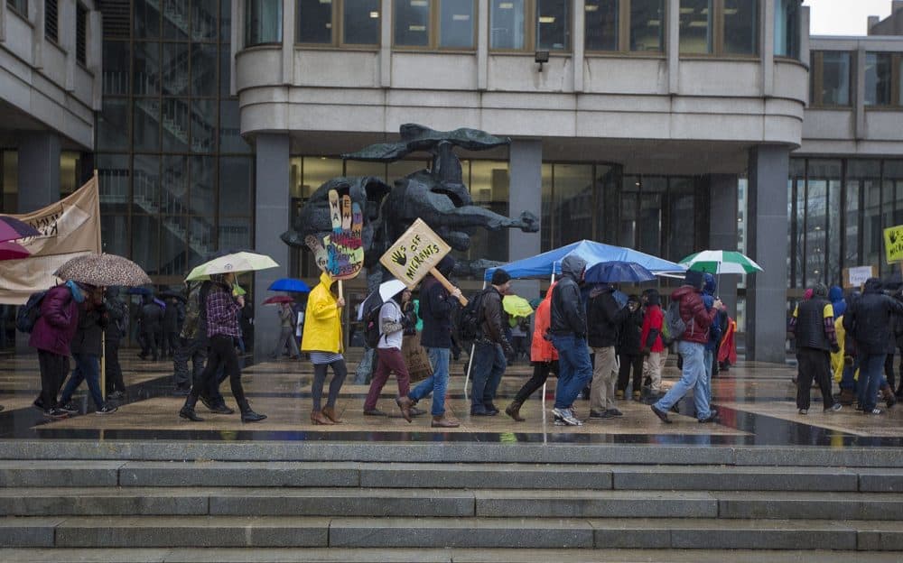 Protesters outside the JFK Federal Building in Boston opposing the detention of a dairy worker and two Vermont activists for immigration charges. (Jesse Costa/WBUR)