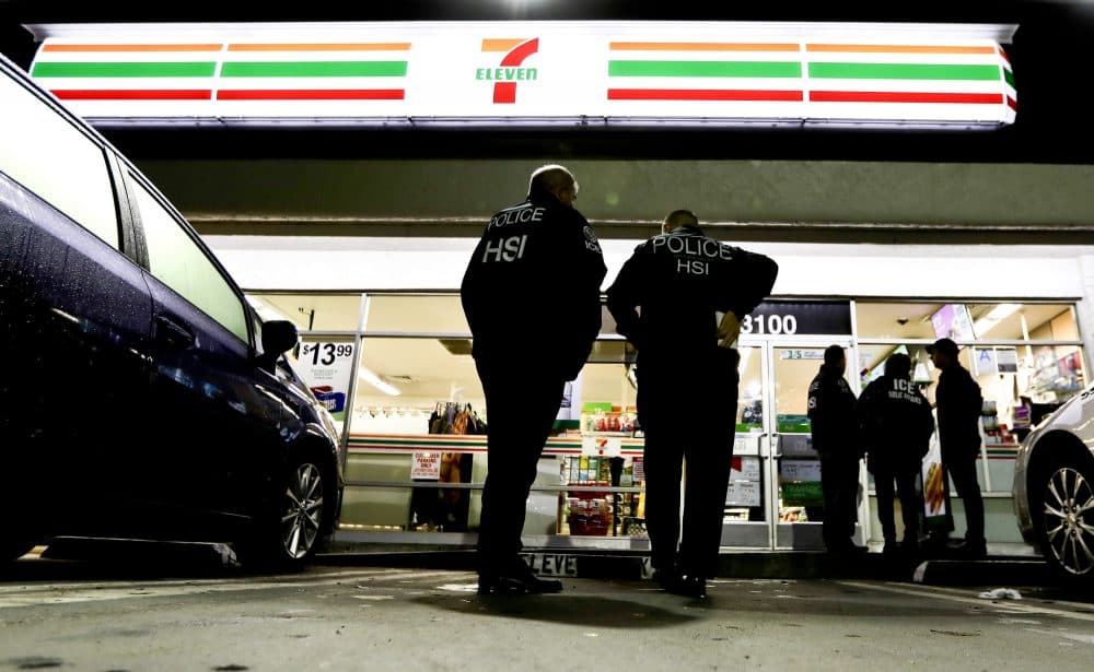 In this Wednesday, Jan. 10, 2018, file photo, U.S. Immigration and Customs Enforcement agents serve an employment audit notice at a 7-Eleven convenience store in Los Angeles. There's been backlash to the state's effort to protect immigrants from stepped up deportations under the Trump administration. (Chris Carlson/AP)
