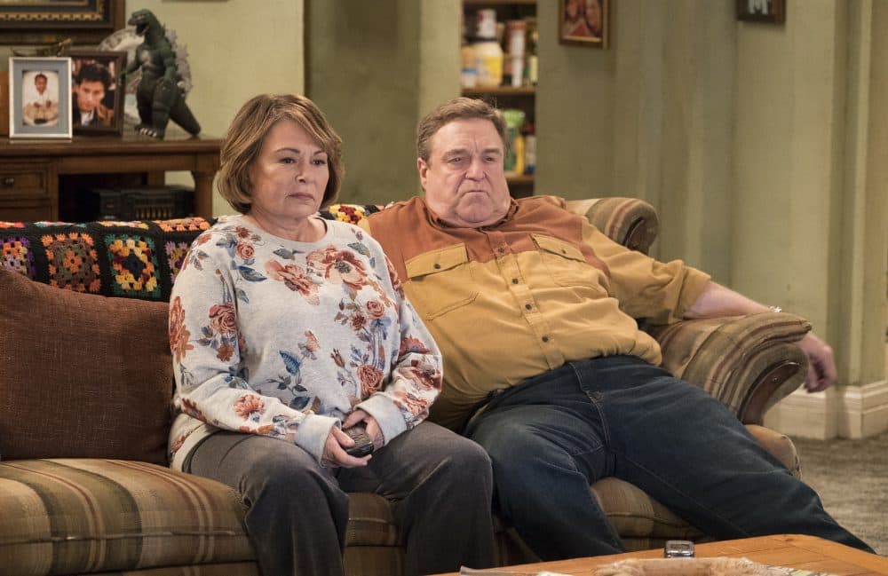 In this image released by ABC, Roseanne Barr, left, and John Goodman appear in a scene from the reboot of "Roseanne." (Adam Rose/ABC via AP)