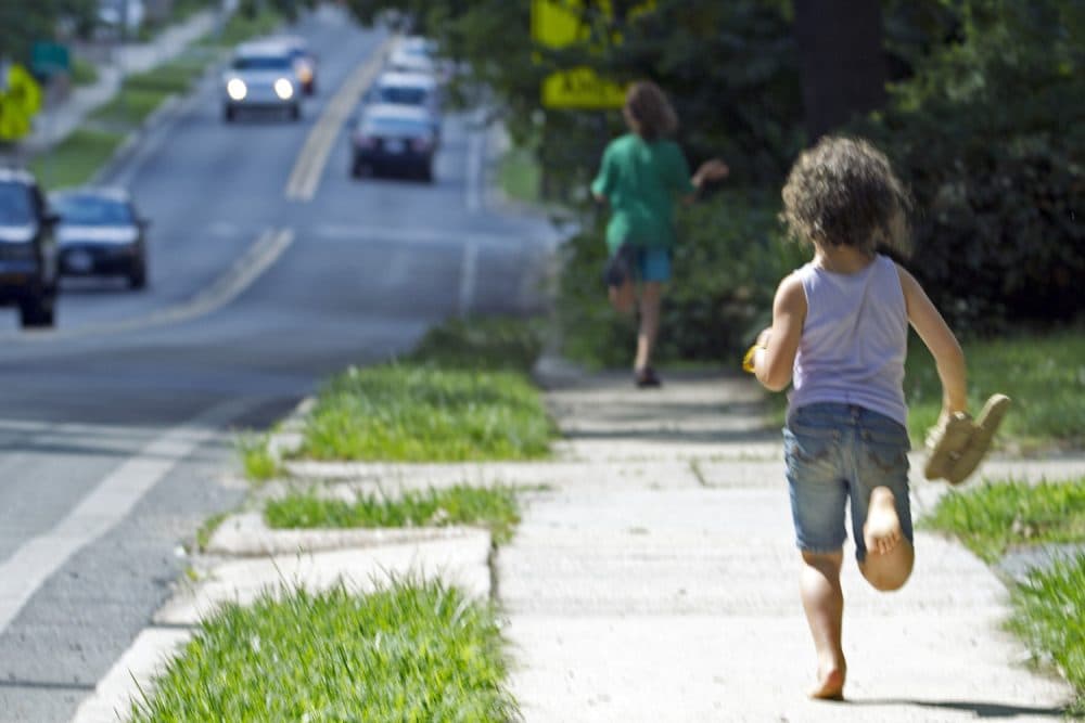 Dvora Meitiv, 6, runs home with her brother Rafi 10, after their mother Danielle Meitiv,pick them up at the school bus stop in Silver Spring Md., on Friday, June 12, 2015. After outcry over one familys free-range parenting case, Maryland officials on Friday clarified the states policy on how authorities handle cases of children walking or playing alone outdoors, saying the state shouldnt investigate unless kids are harmed or face substantial risk of harm. (AP Photo/Jose Luis Magana)