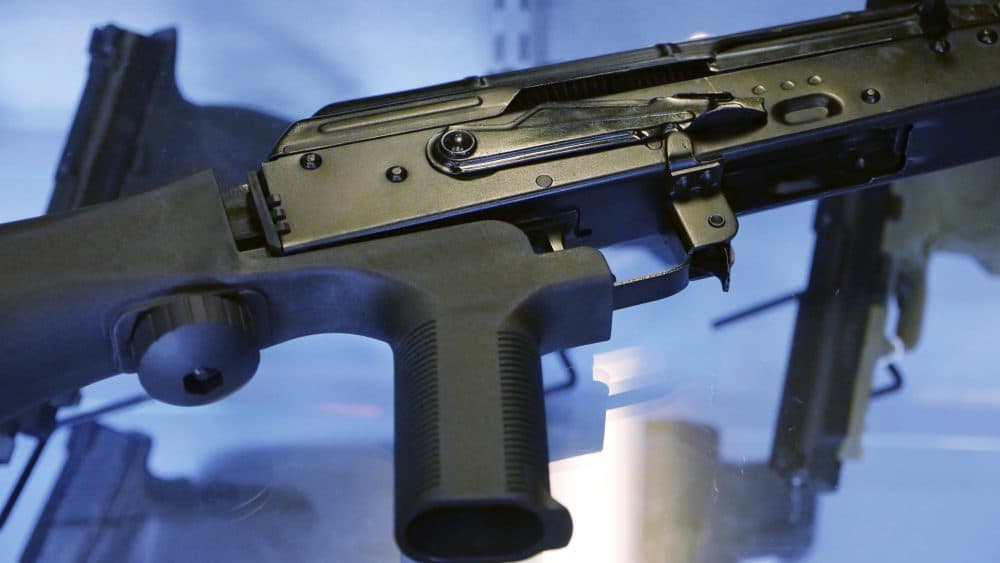 In this Oct. 4, 2017, photo, a device called a "bump stock" is attached to a semi-automatic rifle at the Gun Vault store and shooting range in South Jordan, Utah. (Rick Bowmer/AP)