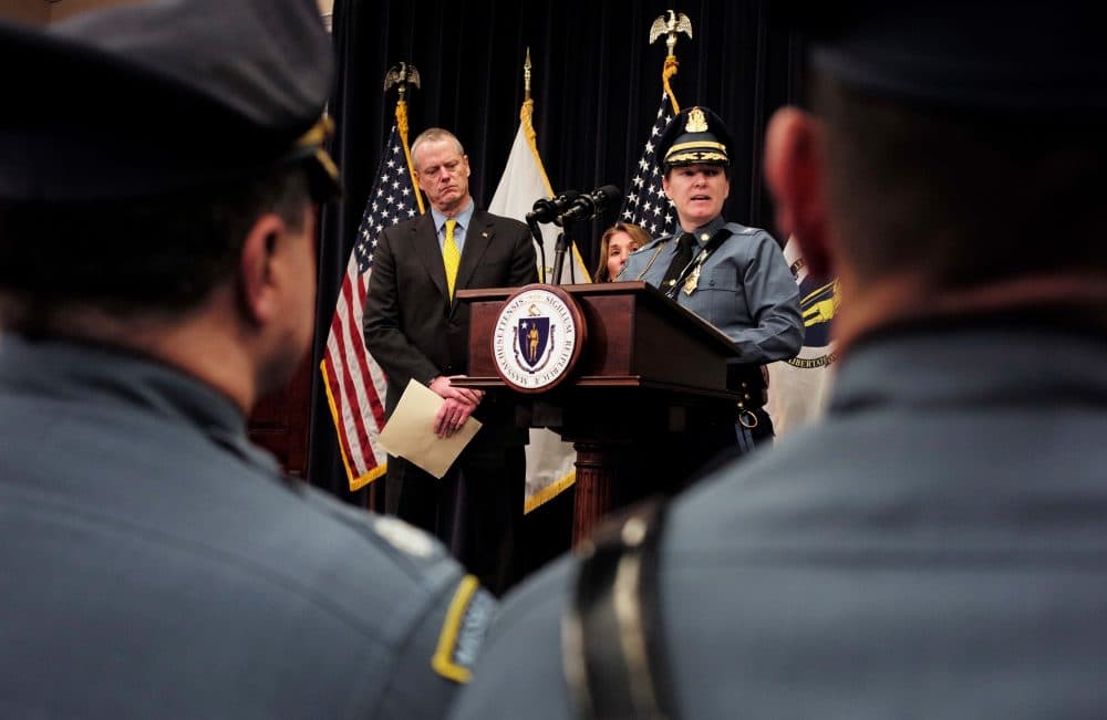 Gov. Charlie Baker and State Police Col. Kerry Gilpin face reporters during a news conference to announce reforms for the embattled agency. (Steven Senne/AP/file)