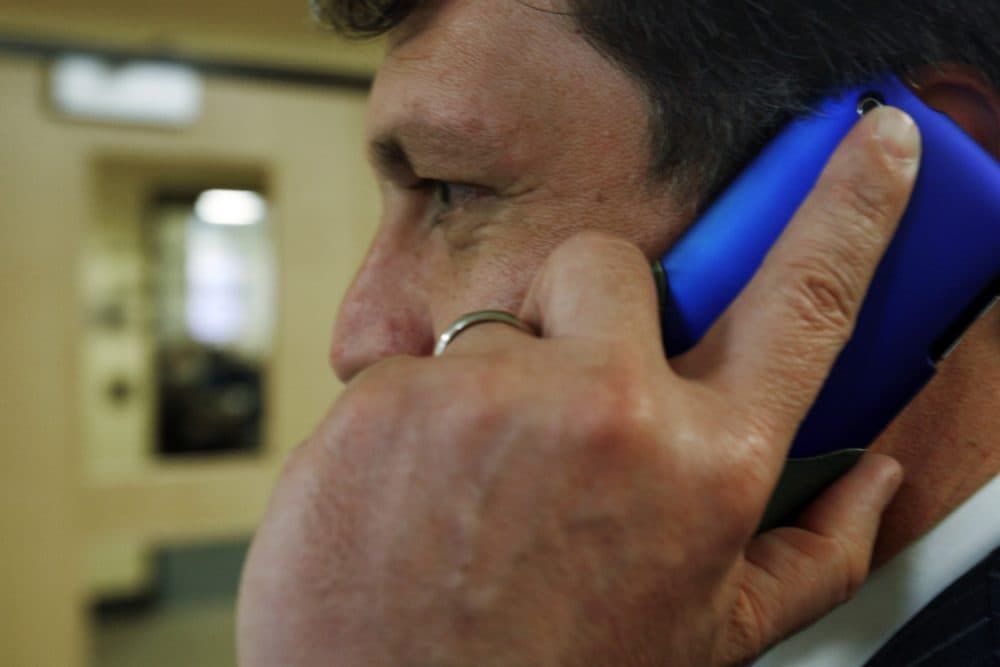 An unidentified man talks on his cell phone outside a hearing  before the Legislature's Health and Human Services Committee concerning cell phone safety, in Augusta, Maine, on Tuesday, March 2, 2010. (Pat Wellenbach/AP)