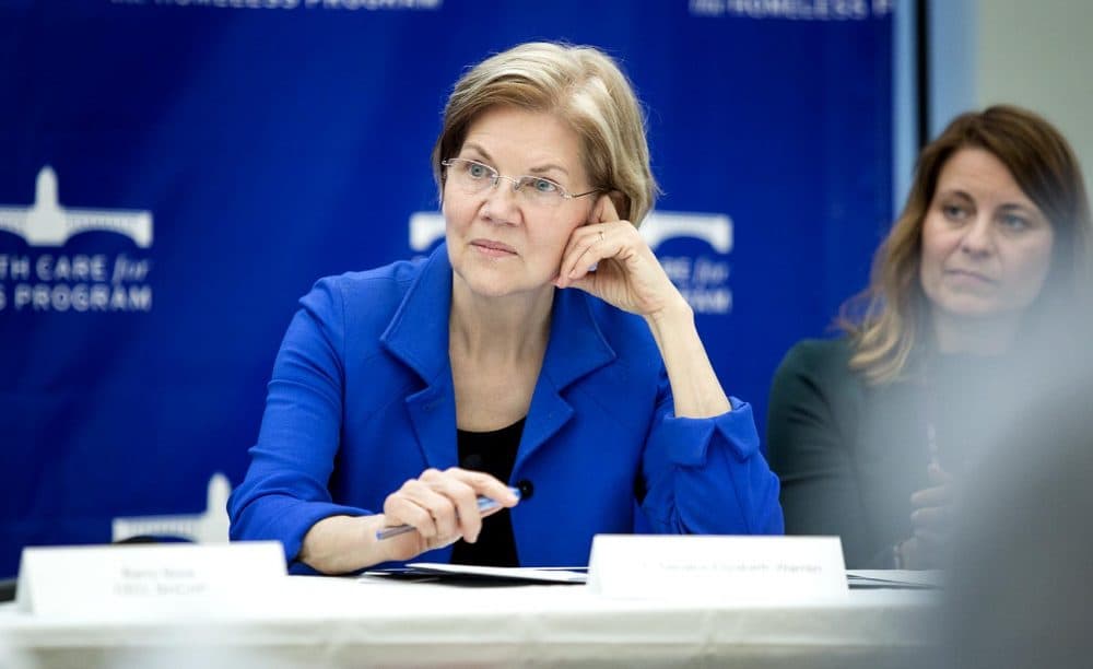 Sen. Elizabeth Warren listens to comments at a round table on the opioid crisis at Boston Health Care for the Homeless. (Robin Lubbock/WBUR)