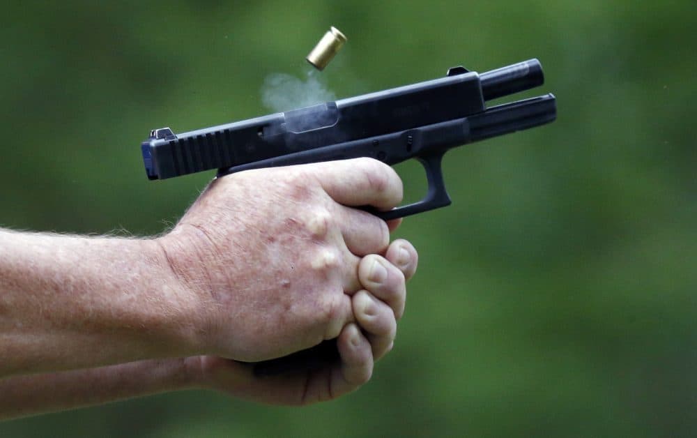 In this April 30, 2016 photograph, a spent round is ejected through gun smoke from a participant's cautomatic handgun during the live fire portion of a enhanced concealed carry class in Petal, Miss. (Rogelio V. Solis/AP)