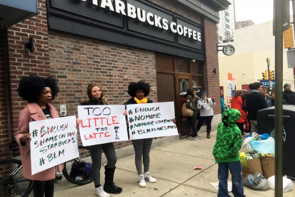 Protesters gather outside a Starbucks in Philadelphia, Sunday, April 15, 2018, where two black men were arrested Thursday after Starbucks employees called police to say the men were trespassing. The arrest prompted accusations of racism on social media. Starbucks CEO Kevin Johnson posted a lengthy statement Saturday night, calling the situation &quot;disheartening&quot; and that it led to a &quot;reprehensible&quot; outcome. (Ron Todt/AP)