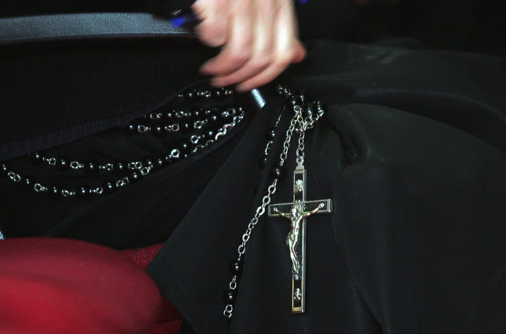 A detail of a priest's crucifix during a lesson by an official exorcist of the Roman Catholic church, at the Regina Apolostolorum pontifical university in Rome in 2005. (Alberto Pizzoli/AFP/Getty Images)
