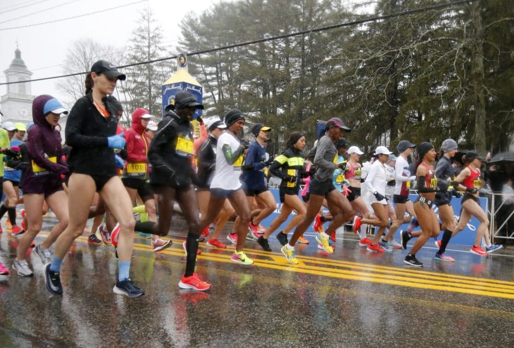 The elite female runners break from the starting line in a downpour during the 122nd running of the Boston Marathon. (Mary Schwalm/AP)