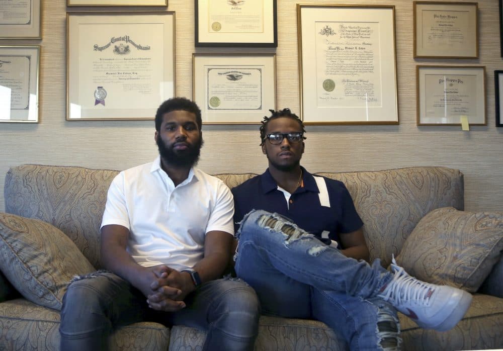 Rashon Nelson, left, and Donte Robinson, right, both 23, sit on their attorney's sofa as they pose for a portrait following an interview with the AP on April 18, 2018 in Philadelphia. Their arrests at a local Starbucks quickly became a viral video and galvanized people around the country who saw the incident as modern-day racism. In the week since, Nelson and Robinson have met with Starbucks CEO Kevin Johnson and are pushing for lasting changes to ensure that what happened to them doesn't happen to future patrons. (Jacqueline Larma/AP)