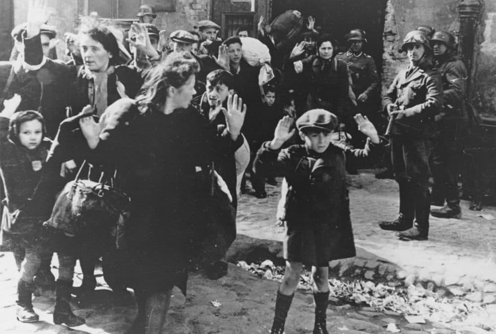 In this April 19, 1943 file photo, a group of Jews are escorted from the Warsaw Ghetto by German soldiers. (AP)