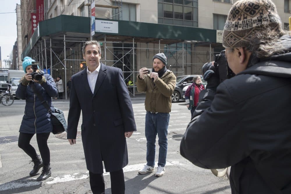 Attorney Michael Cohen is surrounded by photographers as he walks down the sidewalk, Wednesday, April 11, 2018, in New York. Federal agents who raided the office of Cohen, President Donald Trump's personal attorney, were looking for information about payments to a former Playboy playmate and a porn actress who claim to have had affairs with Trump, two people familiar with the investigation said. (AP Photo/Mary Altaffer)