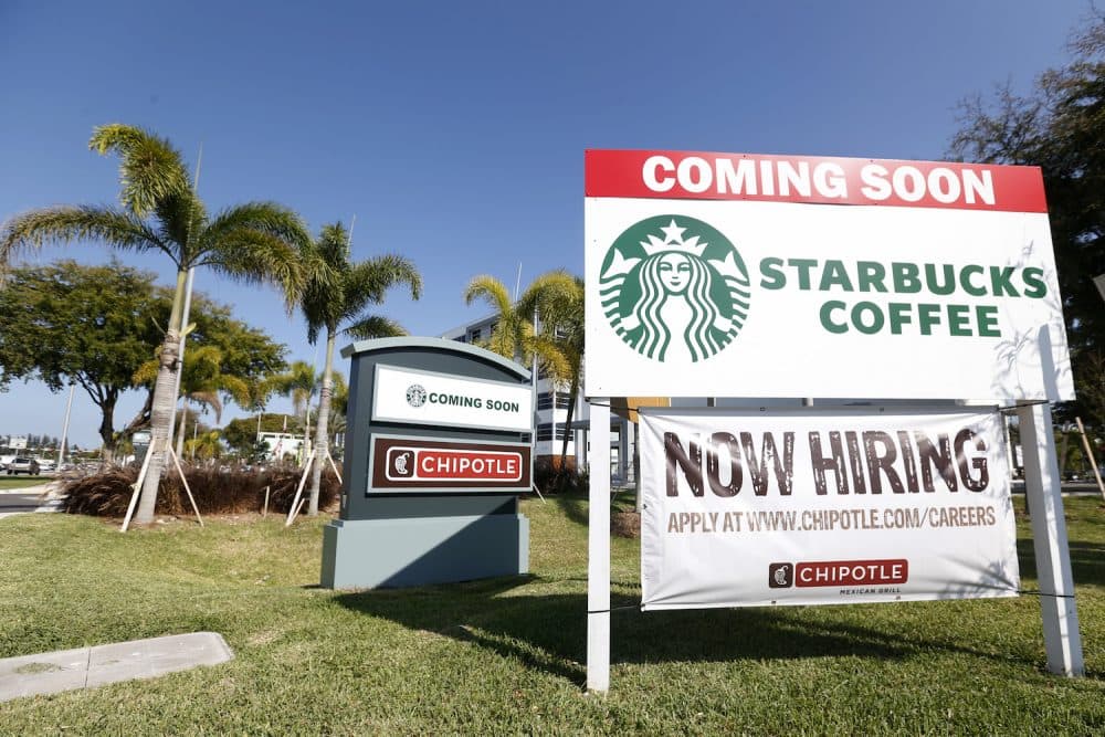 In this Wednesday, April 26, 2017 photo, a "Now Hiring" sign for a new Chipotle Mexican Grill restaurant is shown in Miami. (Wilfredo Lee/AP)