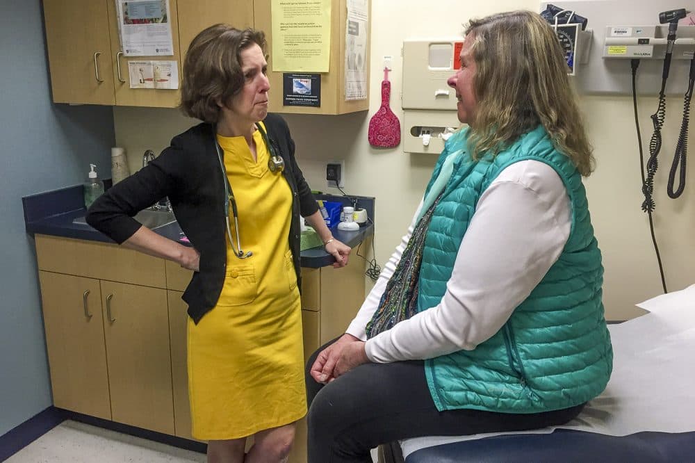 During a routine primary care checkup, Dr. Rebecca Lee opens a difficult conversation with Stacey Regal-O’Hare, who has a serious illness: "What are your goals for the end of life?" (Martha Bebinger/WBUR)