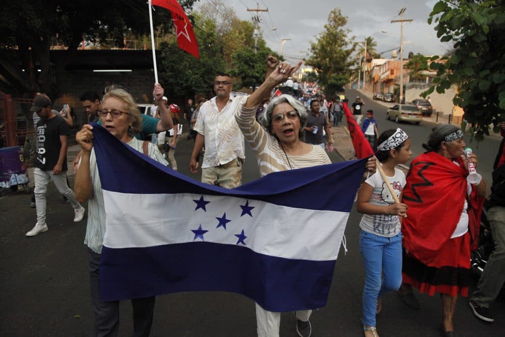 Members of the opposition to the administration of President Juan Orlando Hernandez march to protest the recent decision by the U.S. government to end temporary protected status, or TPS, for tens of thousands of Hondurans who have resided in the United States for nearly two decades, on the streets of Tegucigalpa, Honduras, Friday, May 4, 2018. (Fernando Antonio/AP)