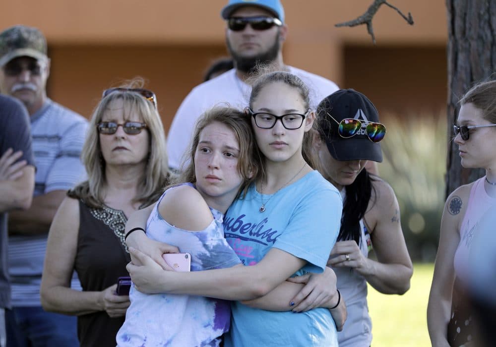 Mourners wait for the start of a prayer vigil following a deadly shooting at Santa Fe High School in Santa Fe, Texas, on Friday, May 18, 2018. (David J. Phillip/AP)