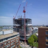 Contruction is rampant all over Kendall Square. The 19-story, 453,768-square-foot office tower at 145 Broadway will be the new home of Akamai Technologies. (Jesse Costa/WBUR)