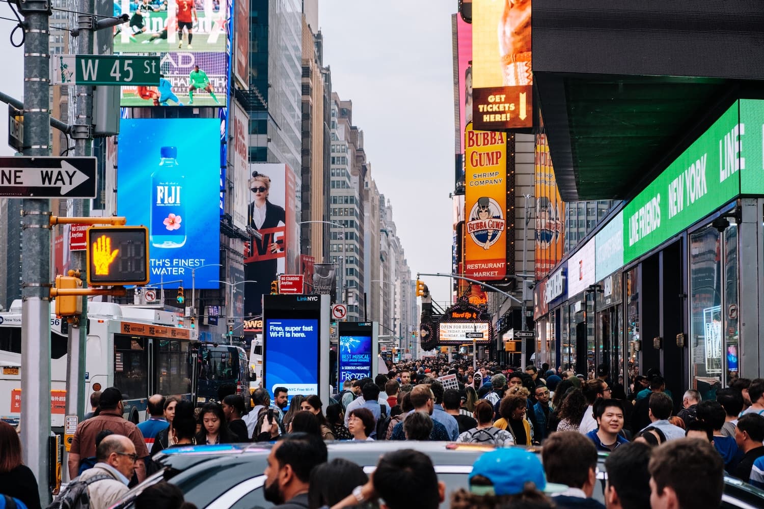 A crowd at Times Square in New York. (Kevin Rajaram/Unsplash)