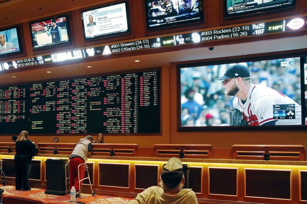 People make bets in the sports book area of the South Point Hotel and Casino in Las Vegas. (John Locher/AP)