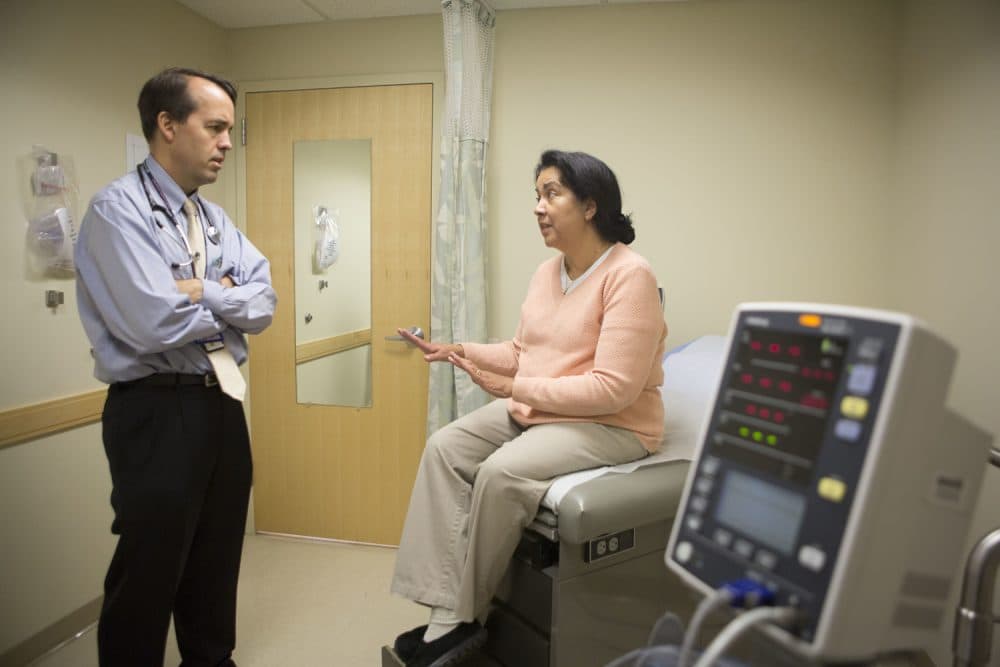 Irma Hendricks, right, talks with her physician Peter P. Reese, MD at Hospital of the University of Pennsylvania in Philadelphia, on Oct. 6, 2016. (Jessica Kourkounis/AP)