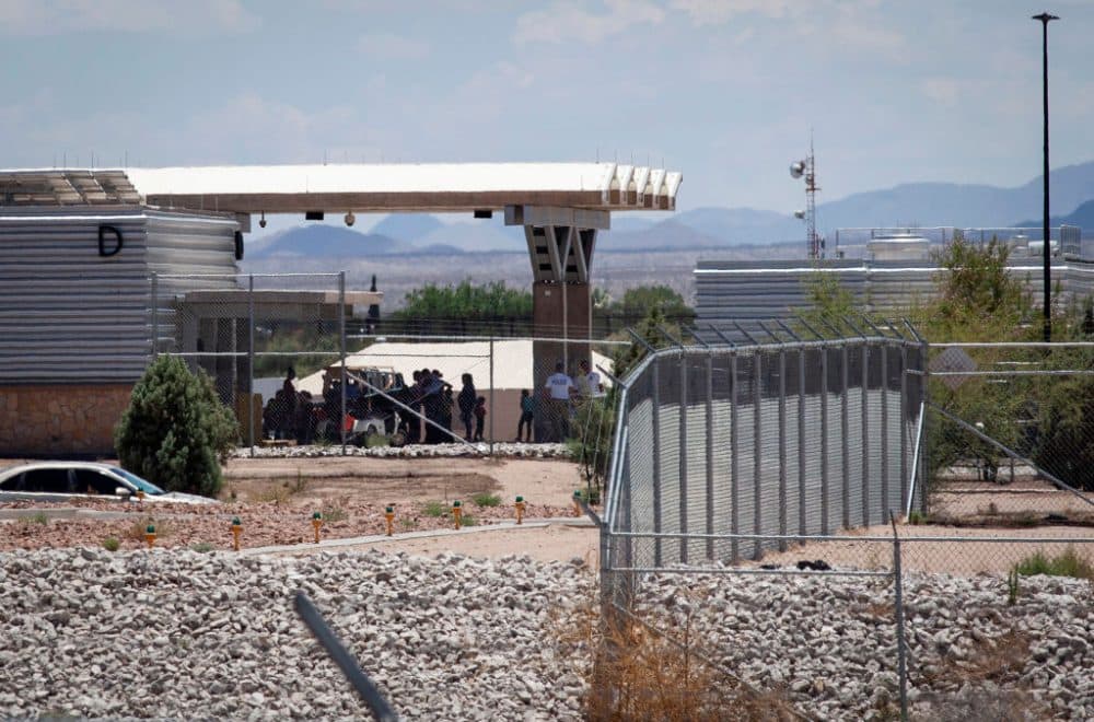 People wait outside the Tornillo-Marcelino Serna Port of Entry, where tents have been built to house unaccompanied migrant children on June 18, 2018 in Tornillo, Texas. The Trump Administration's "zero-tolerance" immigration policy has led to an increase in the number of migrant children who have been separated from their families at the southern U.S. border. (Christ Chavez/Getty Images)