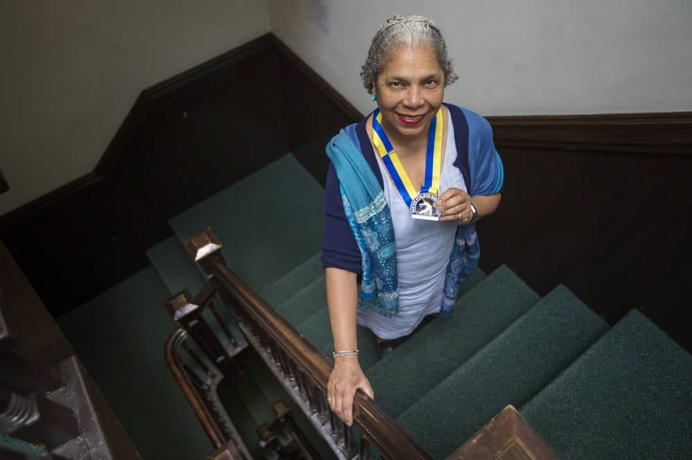 Carol Martin with her Boston Marathon medal from 2018. (Jesse Costa/WBUR)