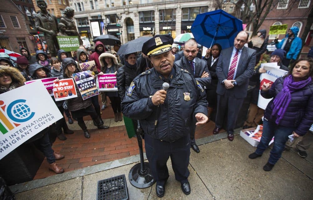 Boston Police Commissioner William Gross speaks to demonstrators during a January 2017 SEIU immigrant rally and reassures them that the Boston police "are not agents of ICE." (Jesse Costa/WBUR)