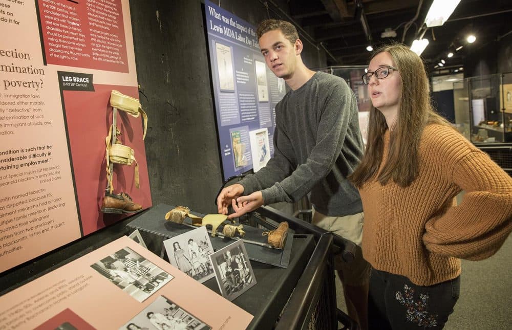 Gann Academy students Gabe Rosen and Elianna Gerut are two of the curators of the "Disability History of the United States" exhibit at the Charles River Museum of Industry & Innovation in Waltham, Mass. (Robin Lubbock/WBUR)