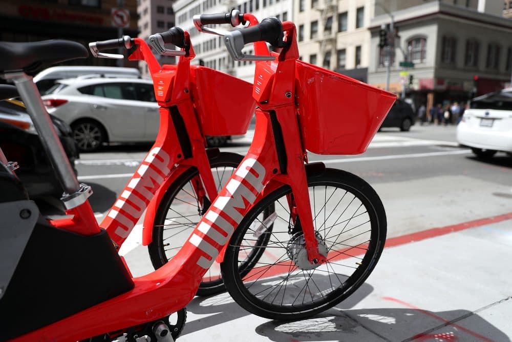 Jump bikes sit parked on a street corner in San Francisco. (Justin Sullivan/Getty Images)