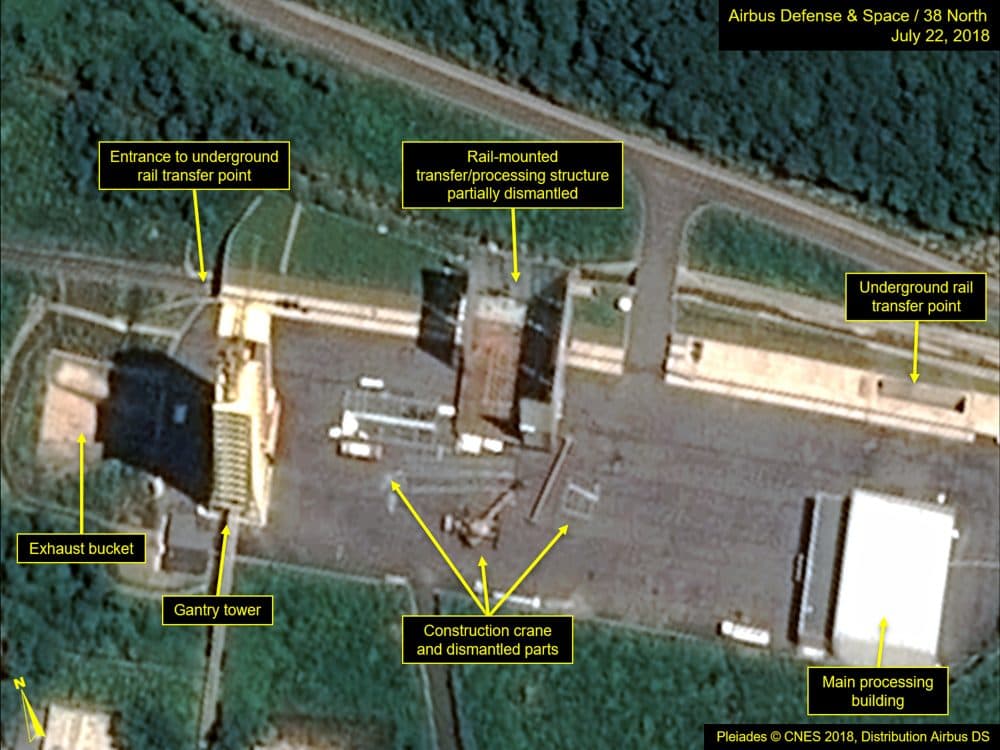 This July 22, 2018, satellite image released and annotated by 38 North on Monday, July 23, shows what the U.S. research group says is the partial dismantling of the rail-mounted transfer structure, at center, at the Sohae launch site in North Korea. (Airbus Defense & Space/38 North via AP)