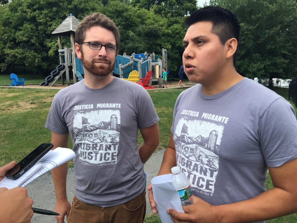 Will Lambek, left, interprets for Enrique Balcazar, a Migrant Justice activist who helped negotiate the fair labor and living standards agreement with Ben & Jerry's. (John Dillon/VPR)
