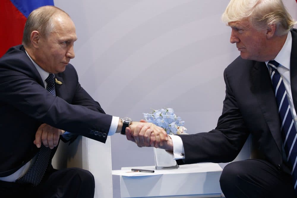 FILE - In this Friday, July 7, 2017 file photo President Donald Trump shakes hands with Russian President Vladimir Putin at the G20 Summit in Hamburg. (AP Photo/Evan Vucci, File)