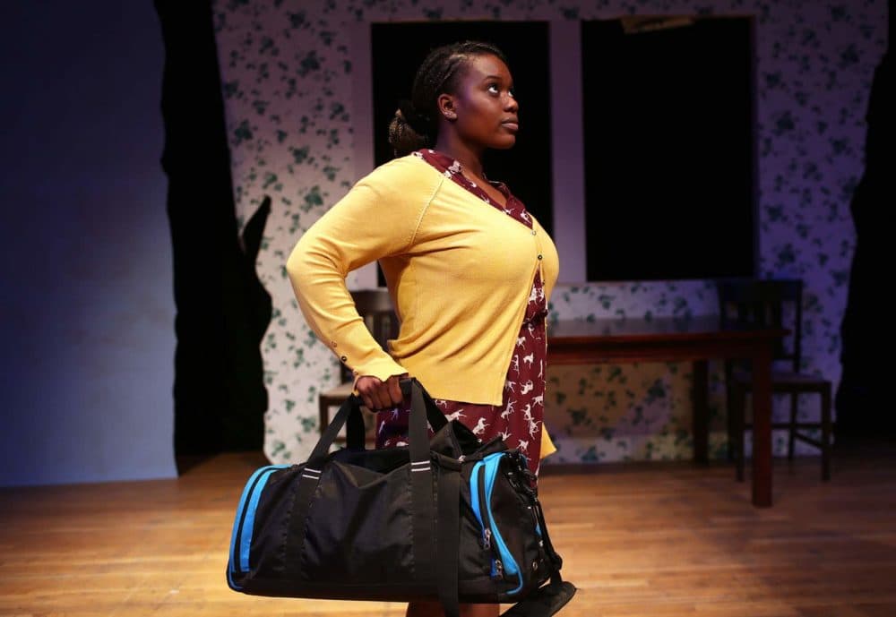 Tenneh Sillah of Roslindale goes through a scene during rehearsal for "This Placed / Displaced" at the Charlestown Working Theater. (Hadley Green for WBUR)
