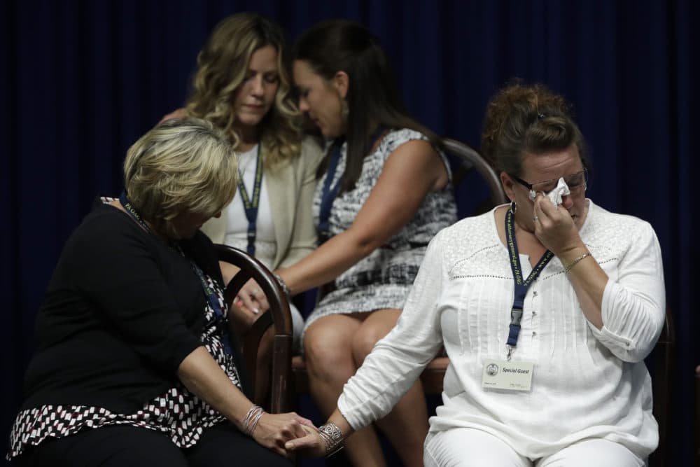 Victims of clergy sexual abuse, or their family members react as Pennsylvania Attorney General Josh Shapiro speaks during a news conference at the Pennsylvania Capitol in Harrisburg, Pa., Tuesday, Aug. 14, 2018. A Pennsylvania grand jury says its investigation of clergy sexual abuse identified more than 1,000 child victims. The grand jury report released Tuesday says that number comes from records in six Roman Catholic dioceses. (Matt Rourke/AP)
