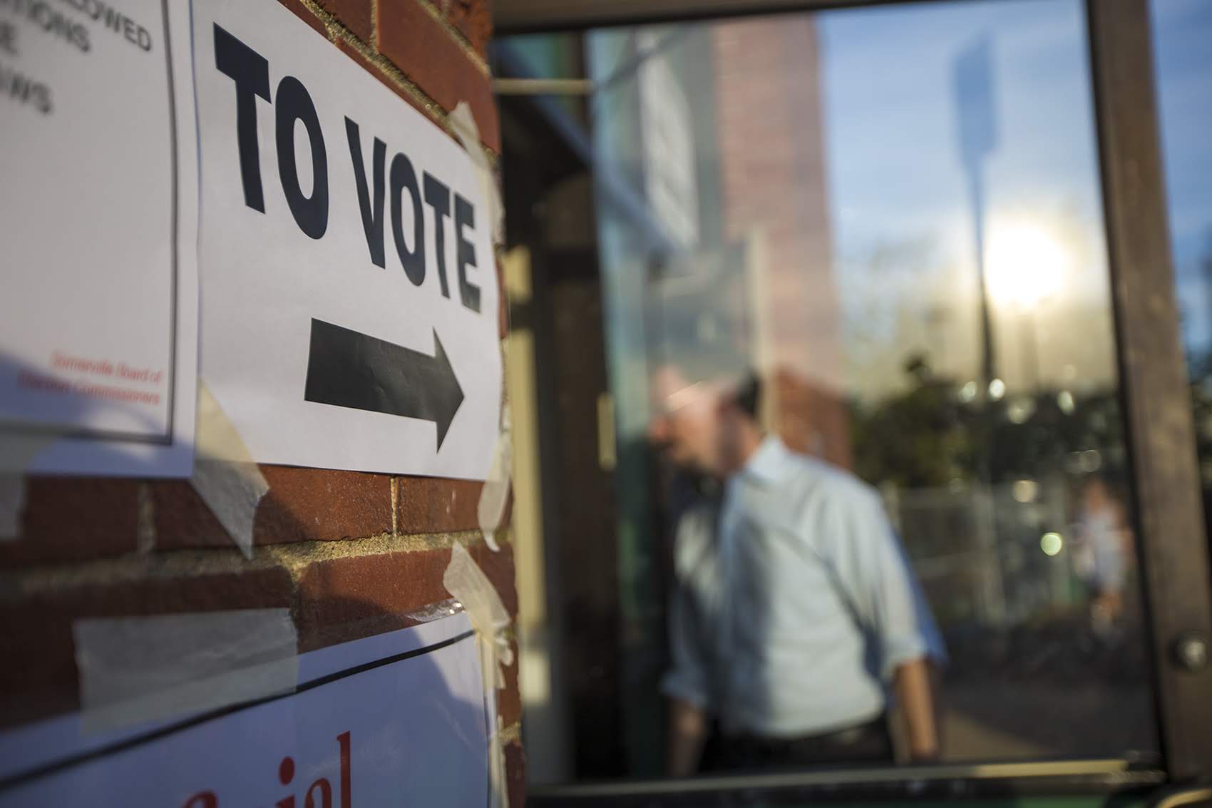 Voters enter the Somerville Department of Public Works in the early morning to vote during the Massachusetts Primary Election. (Jesse Costa/WBUR)