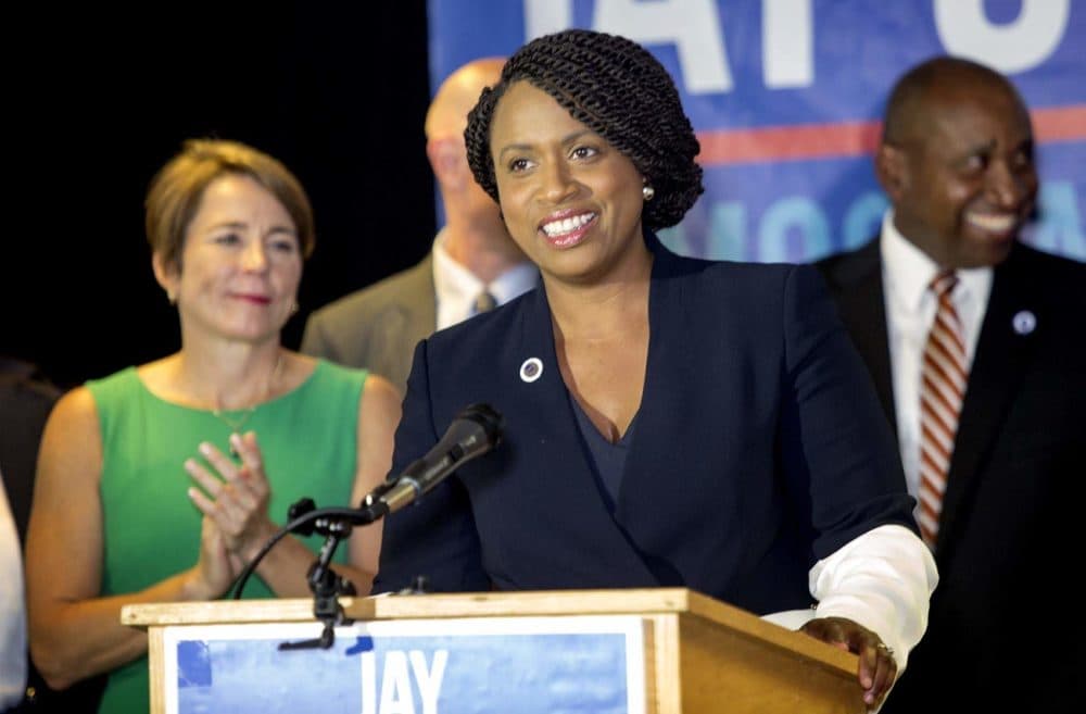 Ayanna Pressley at a Massachusetts Democratic Party Unity event in Dorchester. Attorney General Maura Healey, one of Pressley's most prominent supporters in her race this year, stands behind her. (Robin Lubbock/WBUR)
