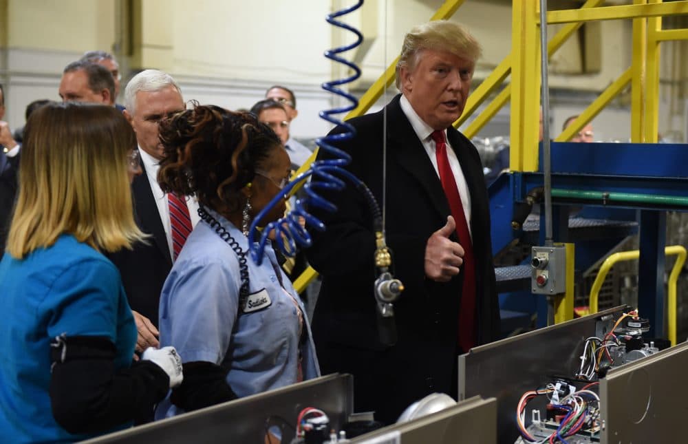President-elect Donald Trump (right) and Vice President-elect Gov. Mike Pence visit the Carrier air conditioning and heating company in Indianapolis on Dec. 1, 2016. (Timothy A. Clary/AFP/Getty Images)