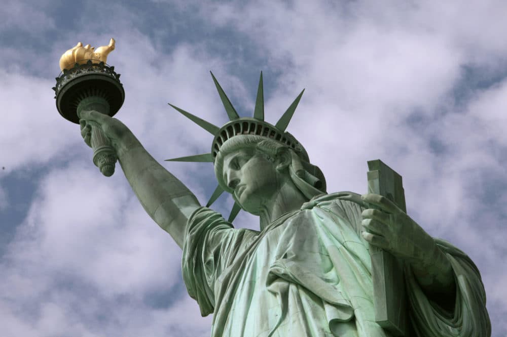 In this June 2, 2009 photo, the Statue of Liberty is seen in New York harbor. The crown is set to open July 4 after being closed since shortly after the Sept. 11, 2001, terrorist attacks. (AP Photo/Richard Drew)