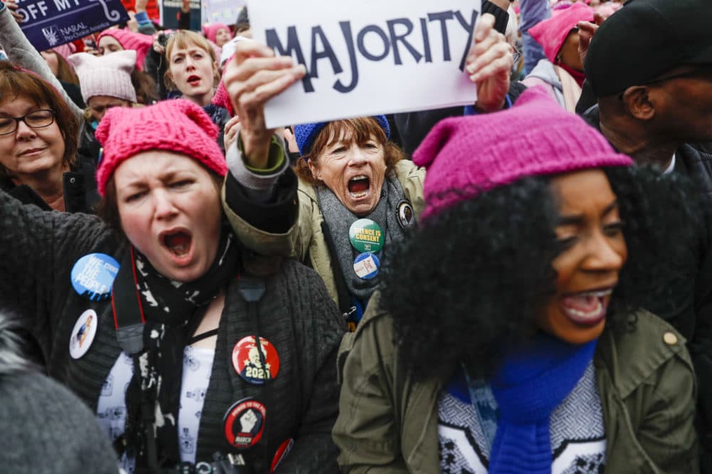 Protesters cheer at the Women's March on Washington during the first full day of Donald Trump's presidency, Saturday, Jan. 21, 2017 in Washington. Organizers of the Women's March on Washington expect more than 200,000 people to attend the gathering. Other protests are expected in other U.S. cities. (AP Photo/John Minchillo)